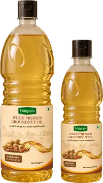 Wood-pressed groundnut oil in 1 litre and 500 ml bottles